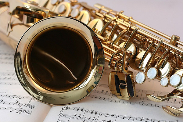 saxophone resting on sheet of music